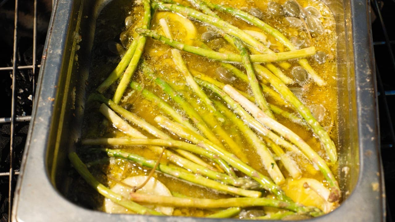 Sheet pan loaded with colorful roasted vegetables and seasoned chicken