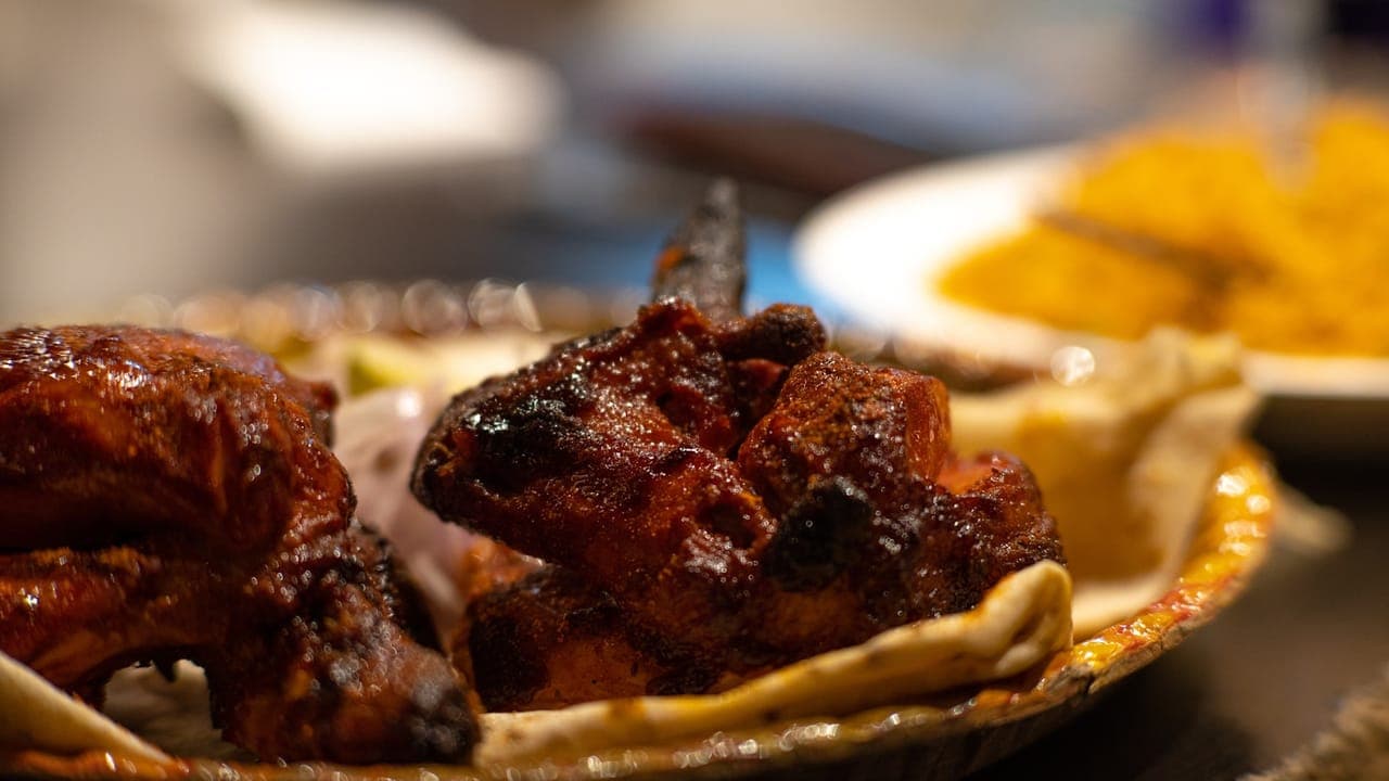 One-pot chicken and yellow rice with peas in a large skillet