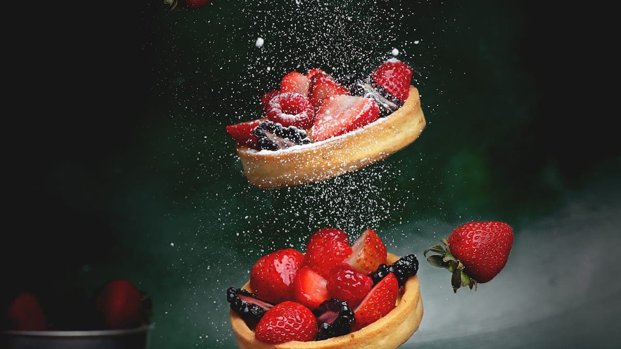 Bowl of creamy rice pudding topped with a sprinkle of cinnamon and raisins